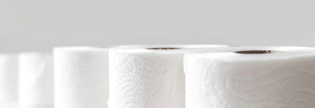 Rows of White Toilet Paper Rolls in a Bright Setting Concept of Hygiene Home Essentials Cleanliness Bathroom Supplies Household Products photo