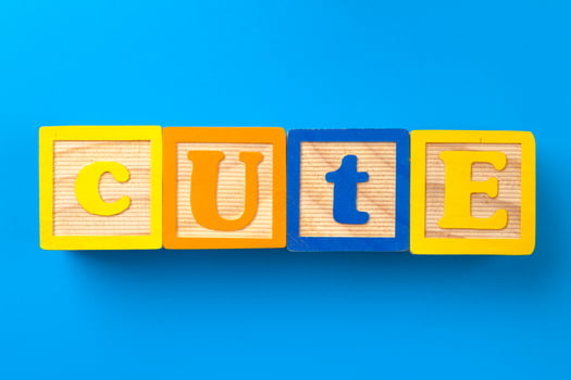 Cute. Wooden colorful alphabet blocks on blue background, flat lay, top view. photo
