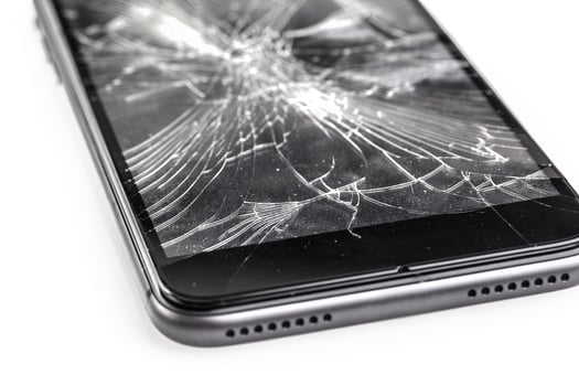 Mobile phone with broken screen photo
