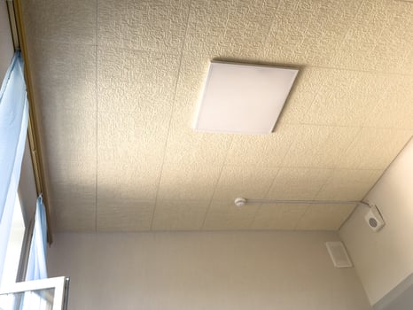 White ceiling with lighting in office room photo