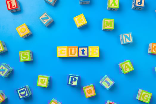 Cute. Wooden colorful alphabet blocks on blue background, flat lay, top view. photo
