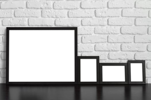 Blank picture frame against brick wall with copy space photo