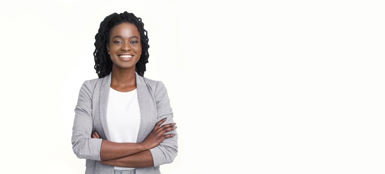 Poised African American businesswoman in a grey blazer and wearing glasses, set against a white background, panoramic view with space for copy. photo
