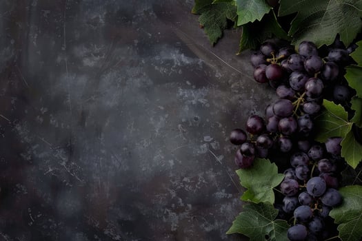 Grapes on a dark background with leaves photo