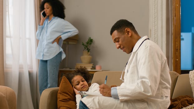 African American mother talking on mobile phone calling doctor pediatrician measuring temperature child daughter little girl sick illness coronavirus fever help patient professional specialist writing photo