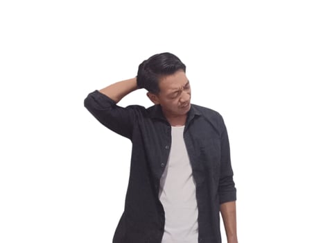 A man in a black shirt holds his neck with a pained expression, indicating discomfort or neck pain. The plain white background emphasizes his distress and highlights photo