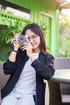 A woman taking a photo with a camera