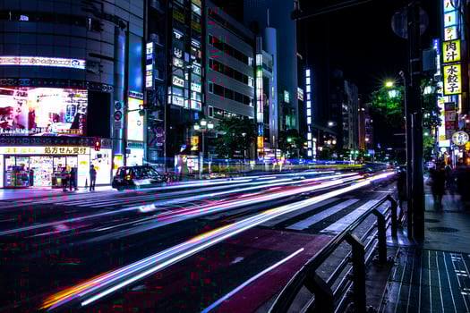 A night neon street in Roppongi Tokyo wide shot photo
