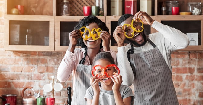 Kitchen Fun. Sweet African Family Having Fun While Cooking, wearing pepper glasses, copy space photo