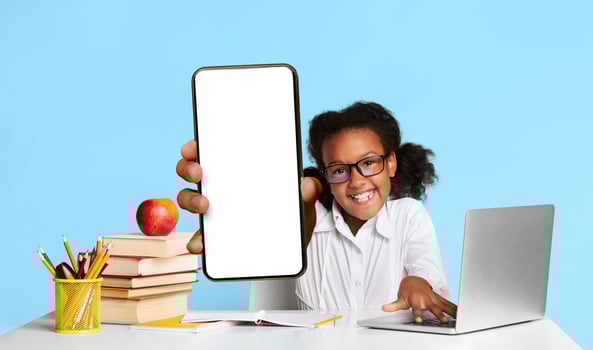 Online Classes. Happy African Schoolgirl At Laptop Raising Hand During Distant Lesson Learning From Home. Yellow Background, Studio Shot photo