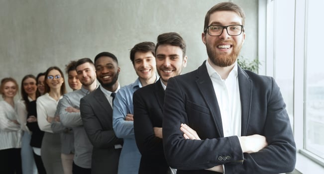 Young diverse business team posing with crossed arms, businesspeople headed with boss photo