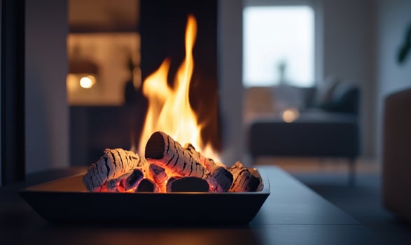 A burning log in a sleek modern fireplace, bright flames photo