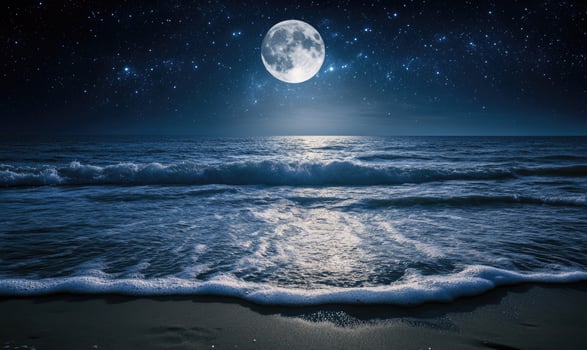 Bright moon casting a long reflection on the ocean photo