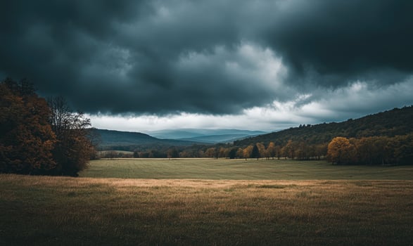 Dark, overcast sky looming above a quiet countryside photo