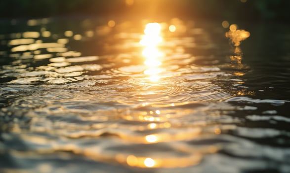 Small waves on the surface of a pond, sunlight glinting off the water photo