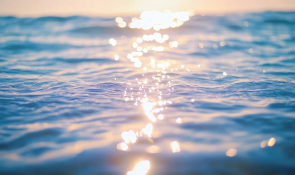 Still ocean surface with tiny waves, soft shimmer from the sunlight photo