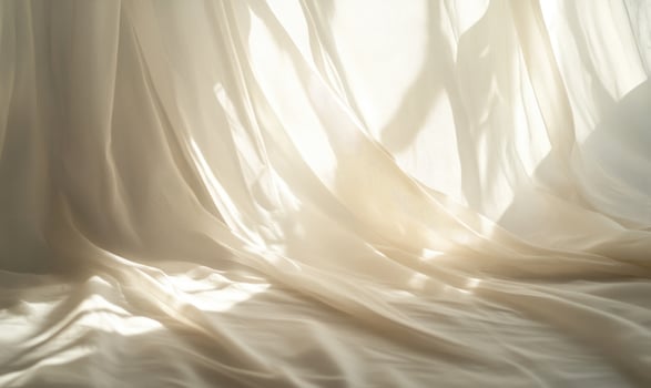 Soft, billowing curtains, gently catching the sunligh photo