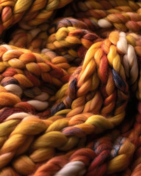 Soft, chunky knit blanket, rich autumnal hues photo