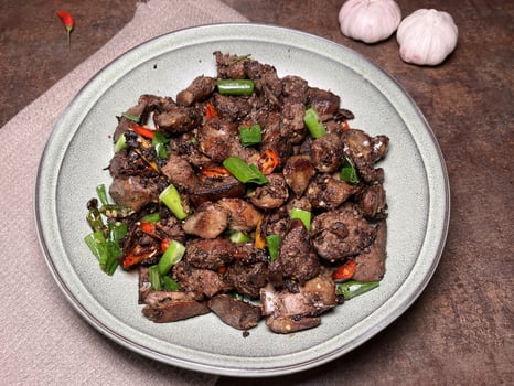 Tumis Ati Goreng is a popular Indonesian stir-fried chicken liver dish known for its rich, savory flavors and spicy kick. The dish typically includes tender chicken liver, sauted with aromatic spices photo