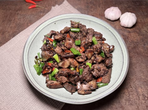 Tumis Ati Goreng is a popular Indonesian stir-fried chicken liver dish known for its rich, savory flavors and spicy kick. The dish typically includes tender chicken liver, sauted with aromatic spices photo