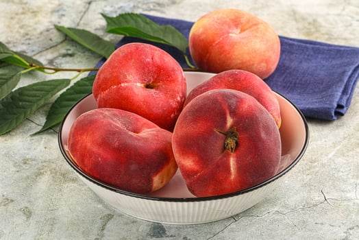Ripe sweet and juicy Flat peach photo