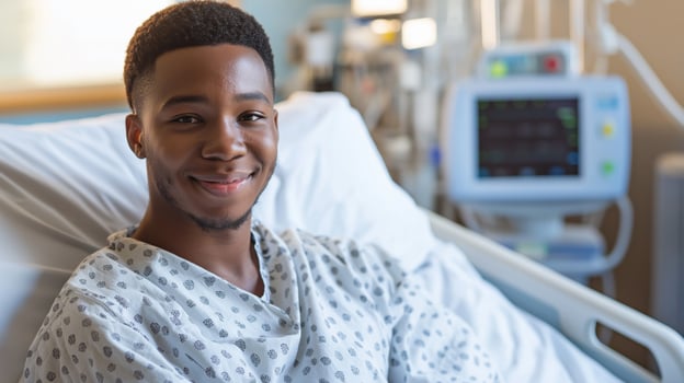 Young African American Male Patient Smiling in Hospital Bed, Medical Environment, Healthcare Concept photo