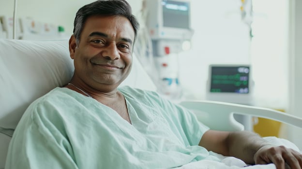 Middleaged Bangladeshi Man Smiling in Hospital Bed, Medical Care, Patient Recovery, Healthcare Setting photo