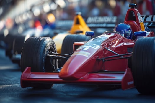 Red formula one race car waiting on the starting grid photo