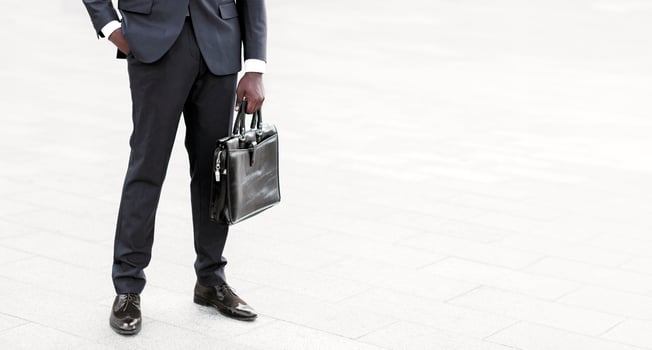 Business Career Concept. Unrecognizable Black Businessman Standing Holding Briefcase In City Outdoors. Copy Space, Cropped photo