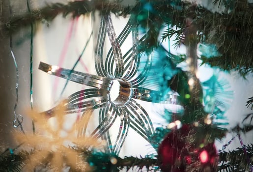 Paper snowflakes in home interior. Christmas and New year decor. photo