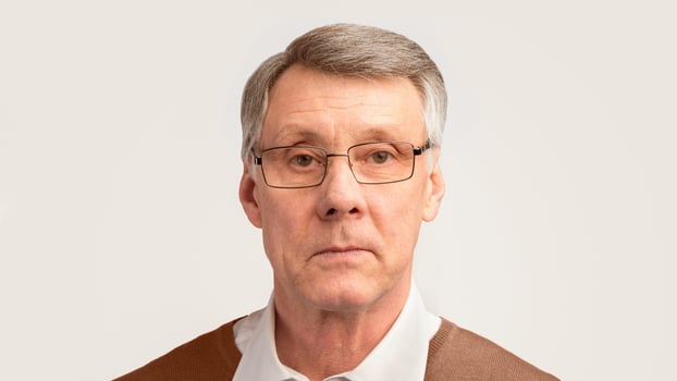 Senior Man Portrait. Serious Elderly Gentleman Looking At Camera Posing On Gray Studio Background. Panorama photo
