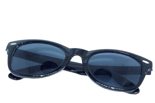 A pair of black sunglasses on a white background photo