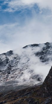 A large mountain with a small mountain on top photo