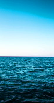A boat is sailing in the ocean photo