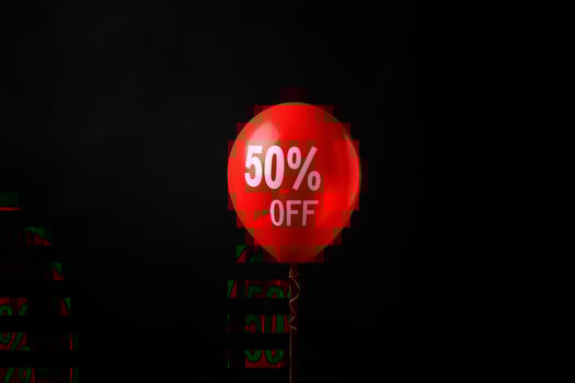 50 off percent discount concept. Bright red balloons on a black background. black Friday sale concept photo