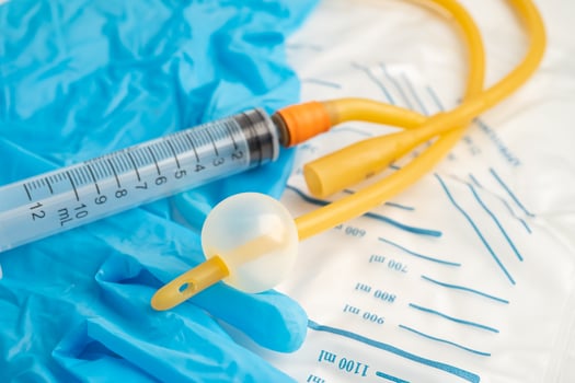 Foley urinary catheter with urine bag for disability or patient in hospital. photo