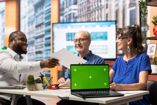Elderly people meeting with a financial expert to develop a secure retirement plan, using a laptop with copy space screen. Search for options to protect savings and secure pension. photo