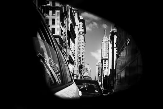 A view of the city through a car mirror photo
