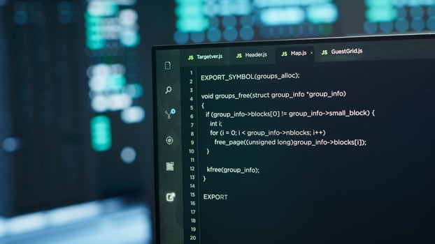Computers in server hub used to ensure optimal performance and reliability, managing mainframes. Close up of code running on PC display in high tech data center used for overseeing network connections photo
