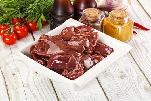 Raw chicken liver uncooked in the bowl photo