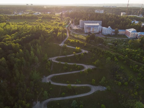 Aerial top vew of winding road in the city photo