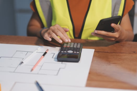 Female architect working at home She looked at the blueprint. photo
