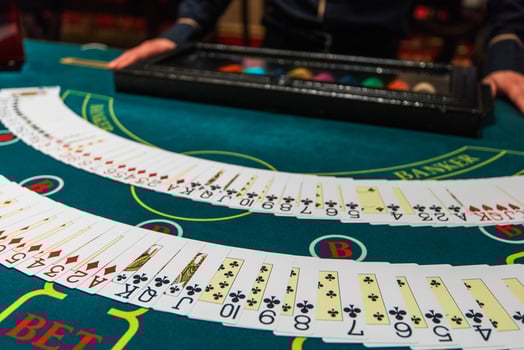 Professional croupier during cards photo