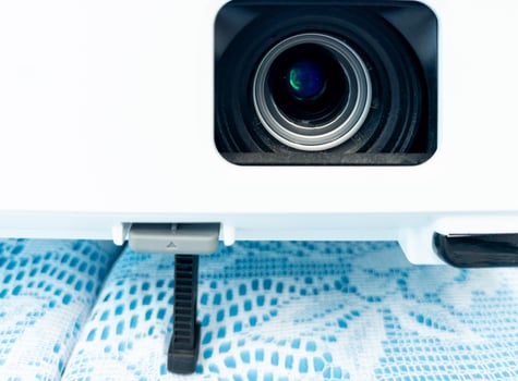 Closeup of the clear lens in the compact projector. photo