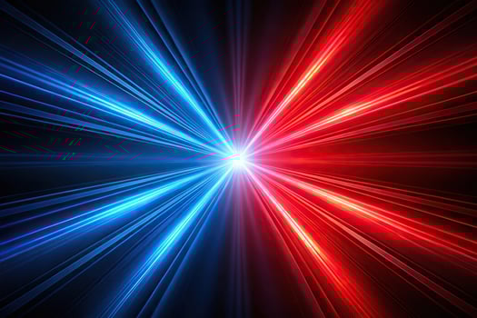 Abstract red and blue light beams against a dark black background photo
