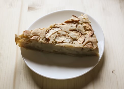 Homemade sweet apple pie with cinnamon and and powdered sugar. photo