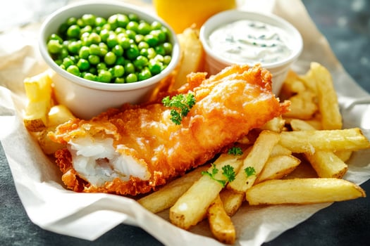 Fish and chips with peas and sauce photo
