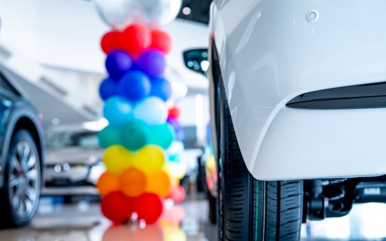 Car parked in luxury showroom. Car dealership office. Car showroom business. New car parked in modern showroom. Auto for sale and rent business. Automobile leasing and insurance. Electric automobile. photo