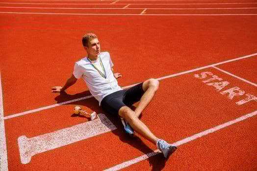 Young Athlete Celebrating Victory on Track photo
