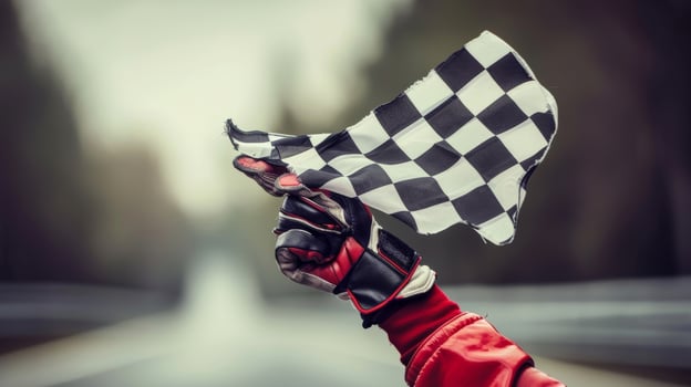 The race winners racing gloves gripping the checkered flag a small piece of fabric representing months of hard work and dedication photo